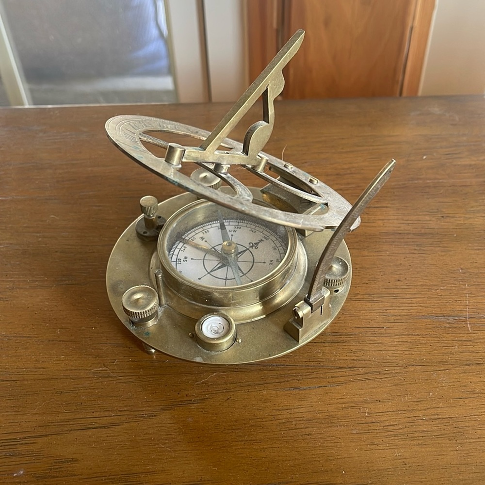 Antique brass sundial and compass
